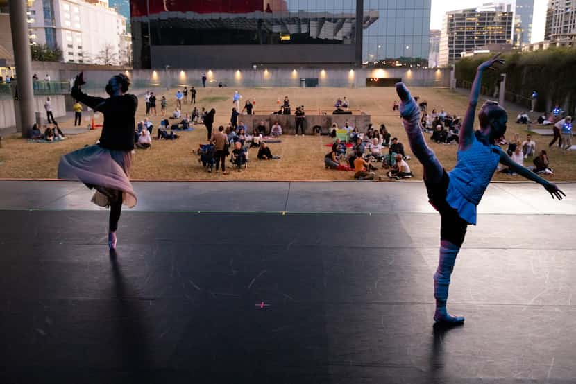 Company members of Avant Chamber Ballet warm up before performing at Annette Strauss Square...