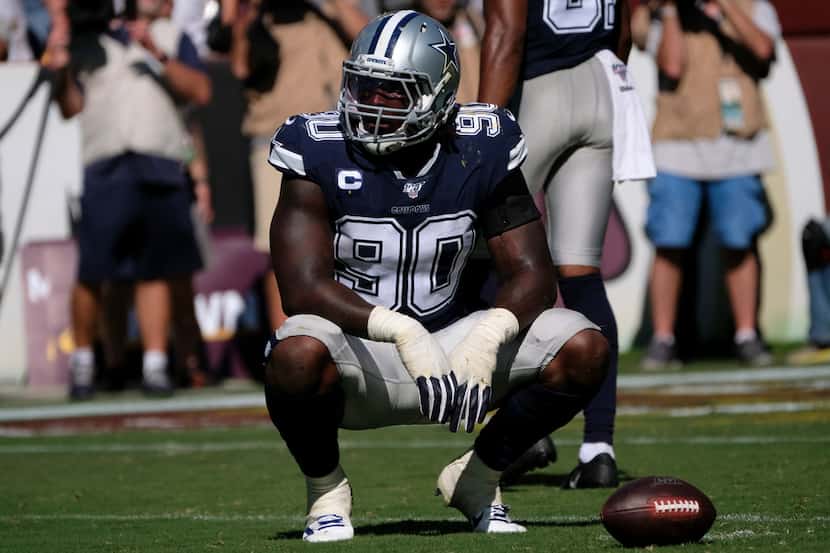 Dallas Cowboys defensive end Demarcus Lawrence rests during a time out during an NFL...