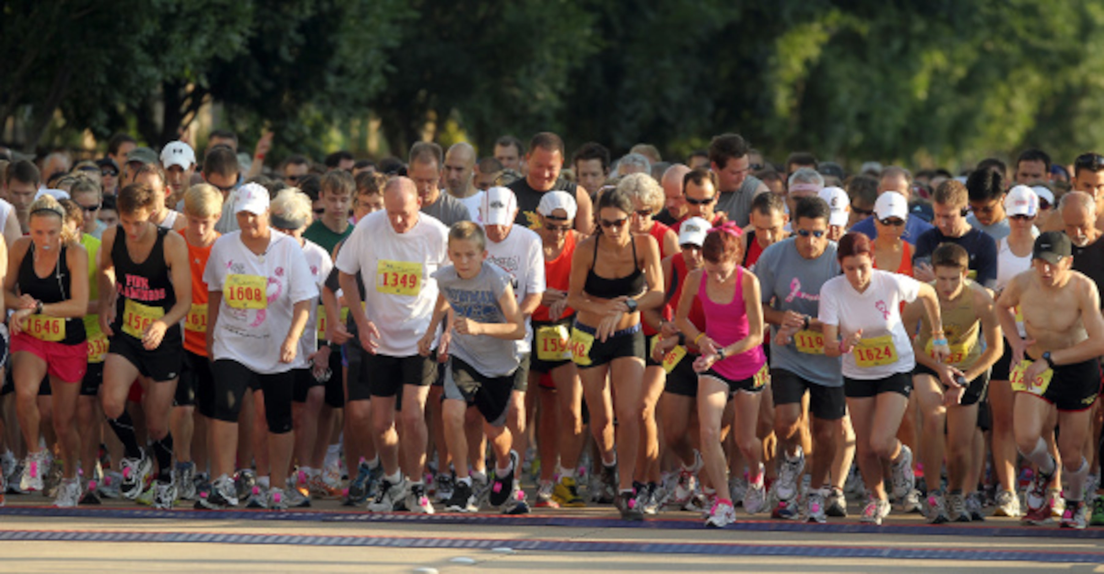 Participants in the competitive 5K head out of the start at the 22nd annual North Texas...