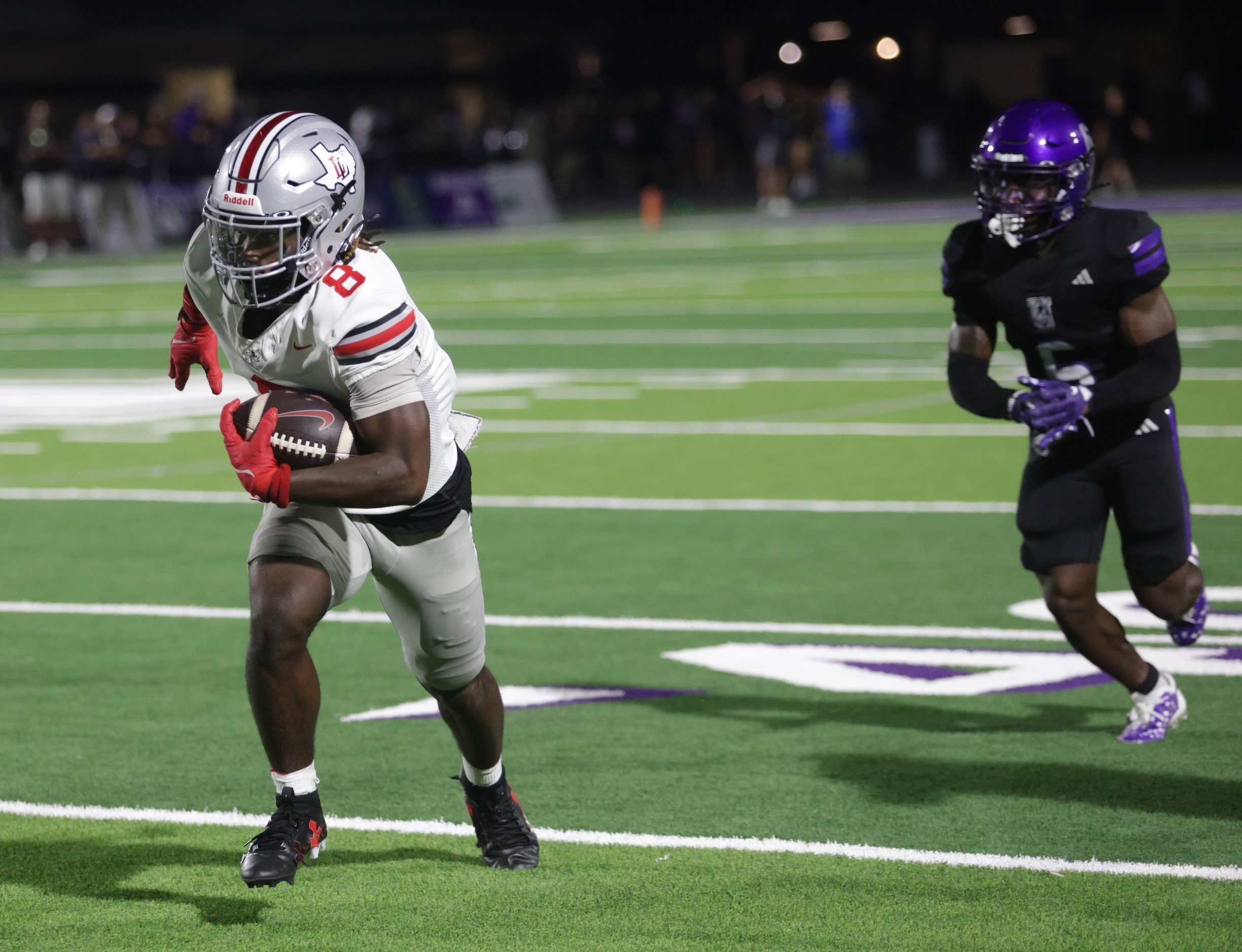 Lovejoy player #8 Jaymez Bean runs the ball during the Lovejoy High School at Anna High...