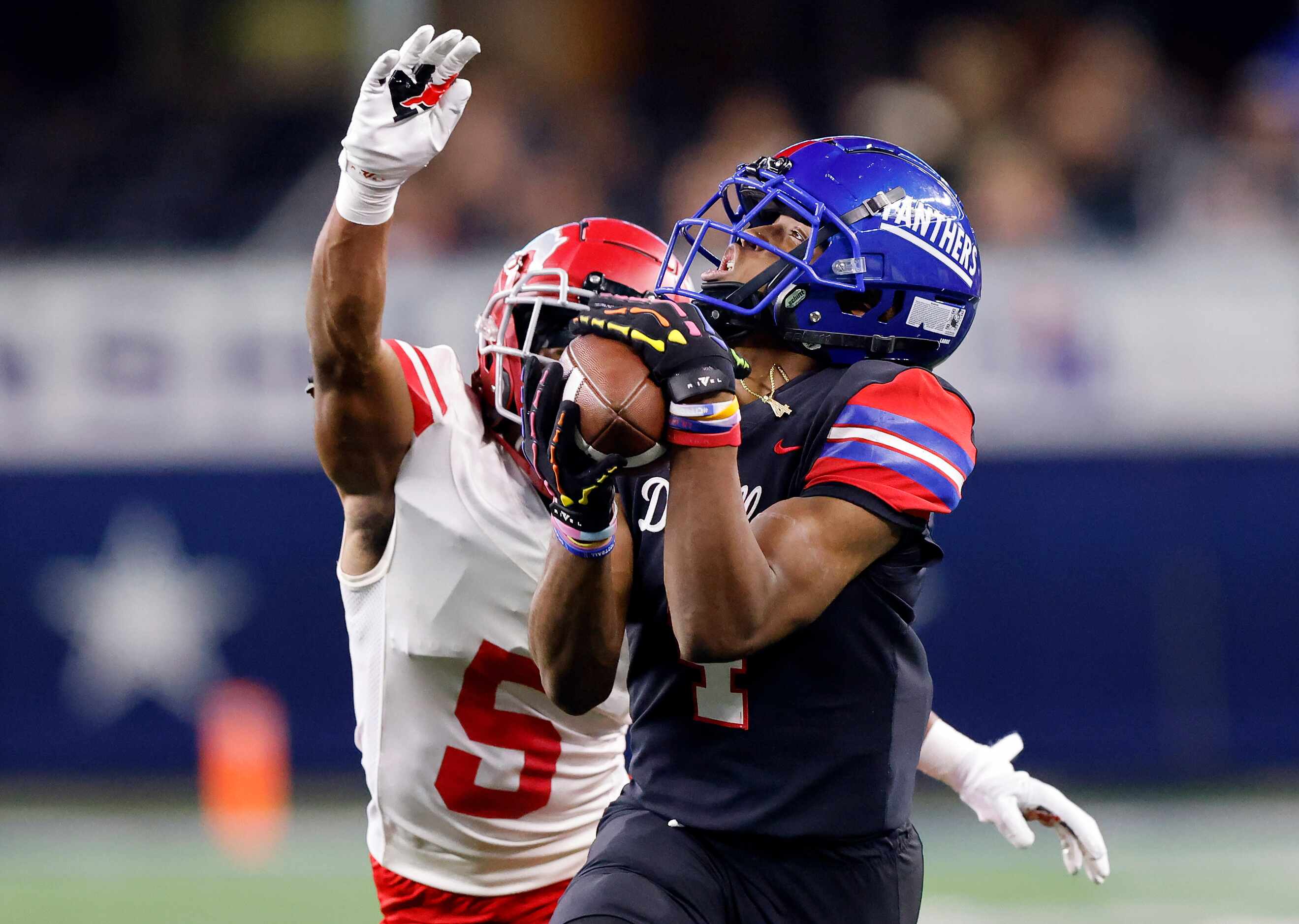 Duncanville wide receiver Dakorian Moore (4) hauls in a long first quarter pass in front of...