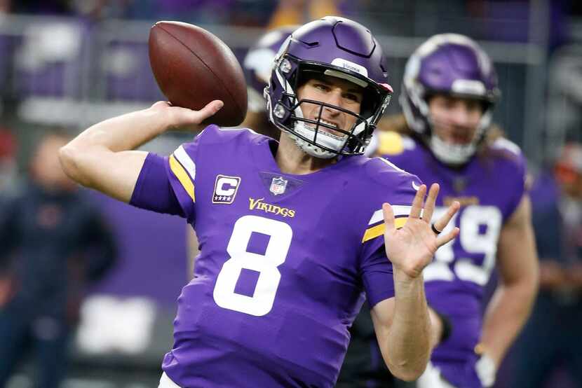 FILE - In this Dec. 30, 2018 file photo, Minnesota Vikings quarterback Kirk Cousins warms up...