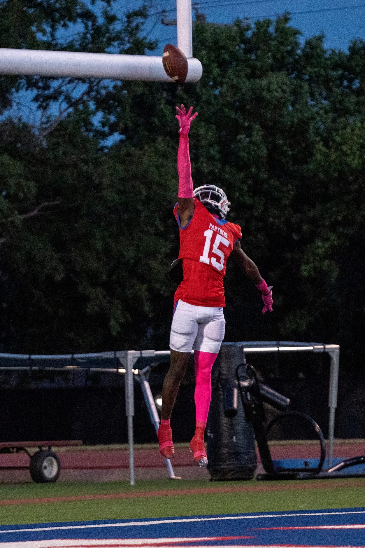 Duncanville senior defensive back Lamoderick Spencer (15) lays the ball up over the goalpost...