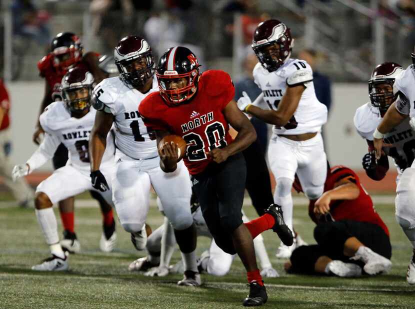 North Garland RB Sabron Woods (20) runs for a first down during the first half of a high...