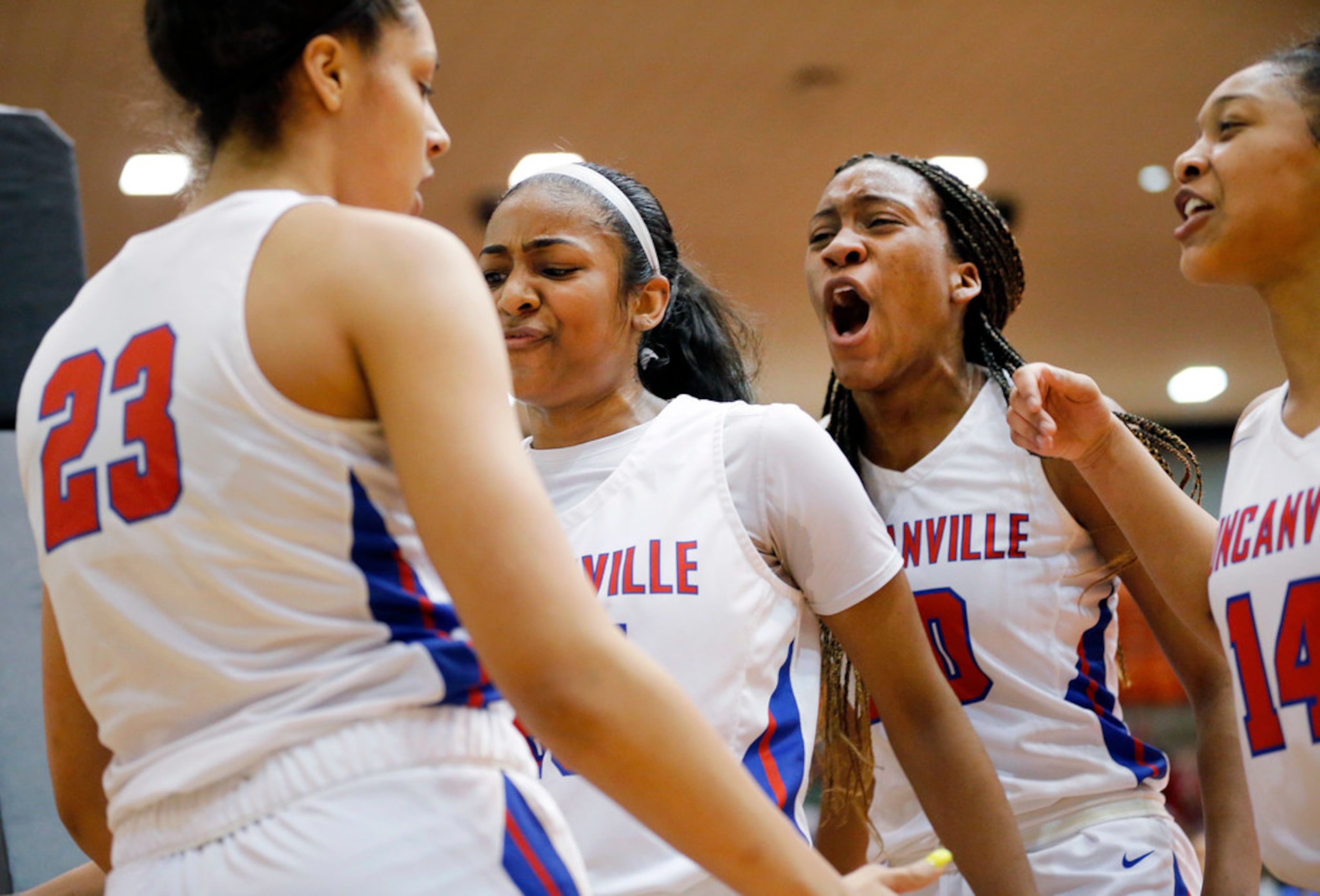 Duncanville's Laila McLeod (23) is congratulated by teammates, including Anaya Bernard...