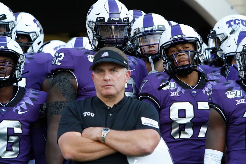 TCU coach Gary Patterson and the players wait in the tunnel before taking the field for an...