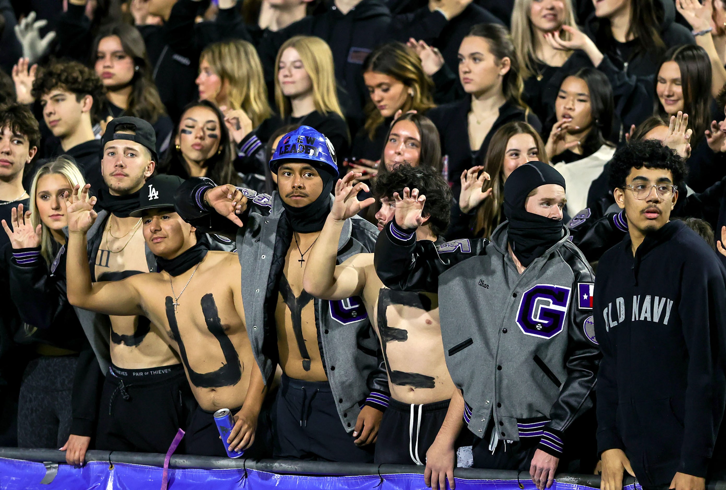 The Denton Guyer students cheer on their Wildcats against McKinney during the first half of...