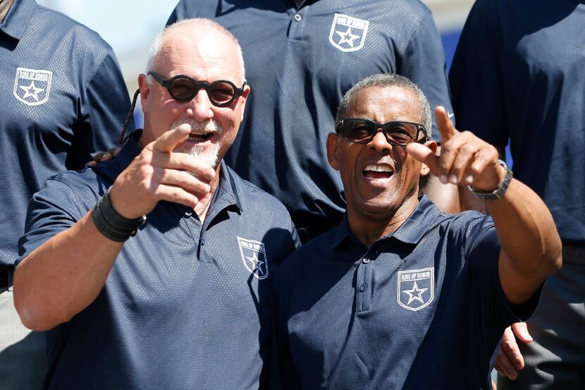 Former Dallas Cowboys Randy White and Tony Dorsett laugh as they spot former Dallas Cowboys...