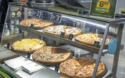 Pizza by the slice, unlimited toppings at one price, and delivery are the three...