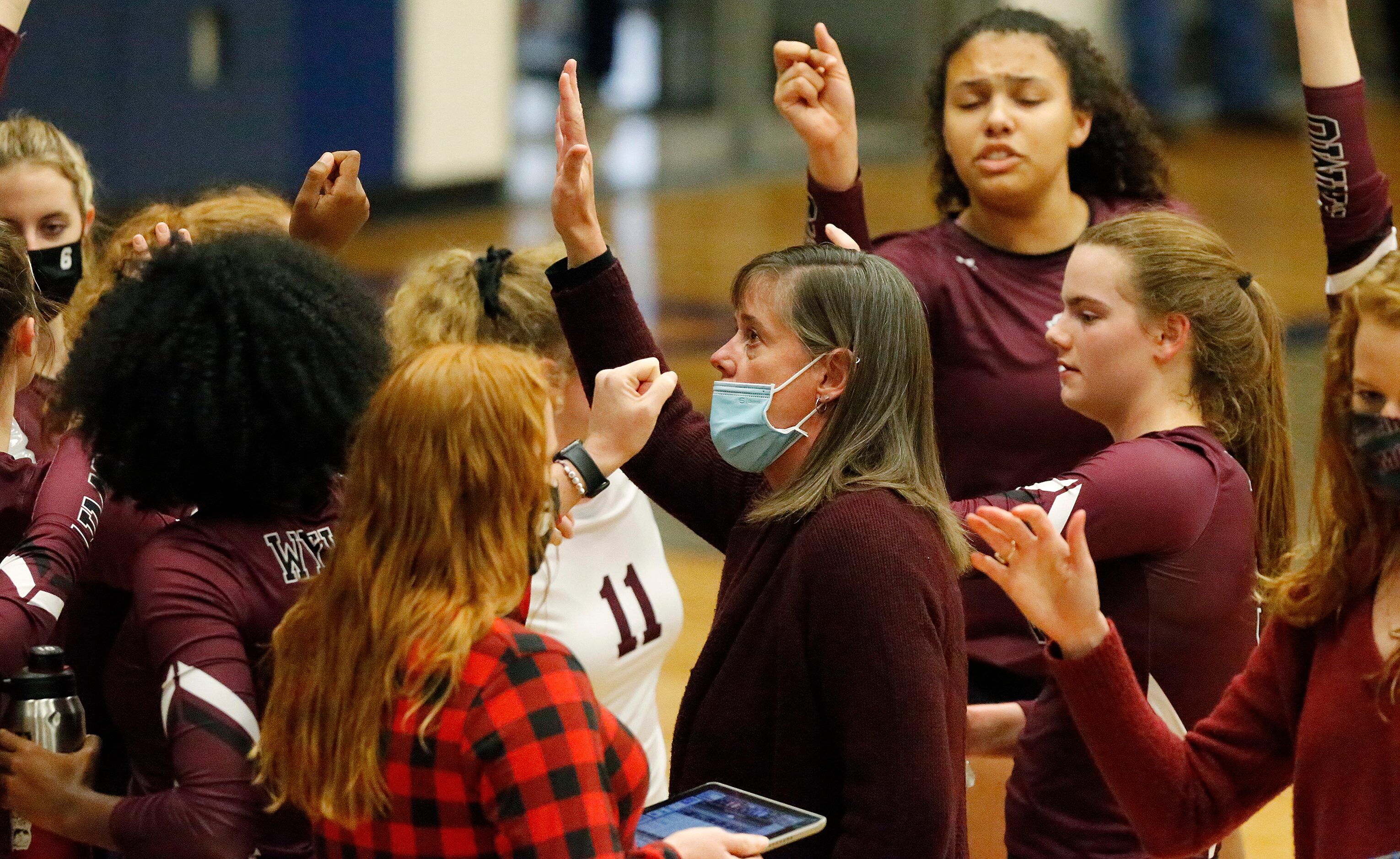 Wylie High School head coach Sherry Olivares leads her team out of a time out during game...