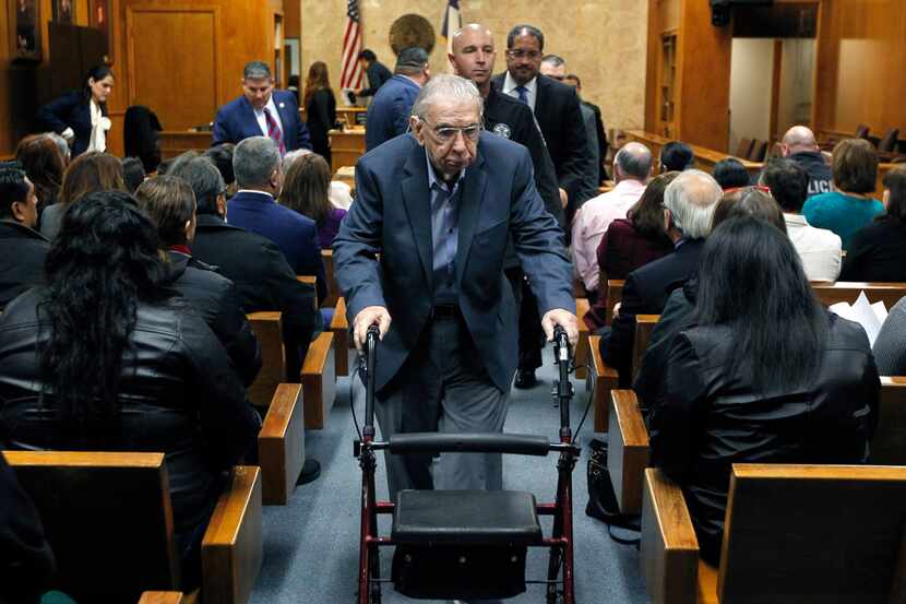 Former priest John Feit leaves the courtroom following closing arguments in his murder trial...