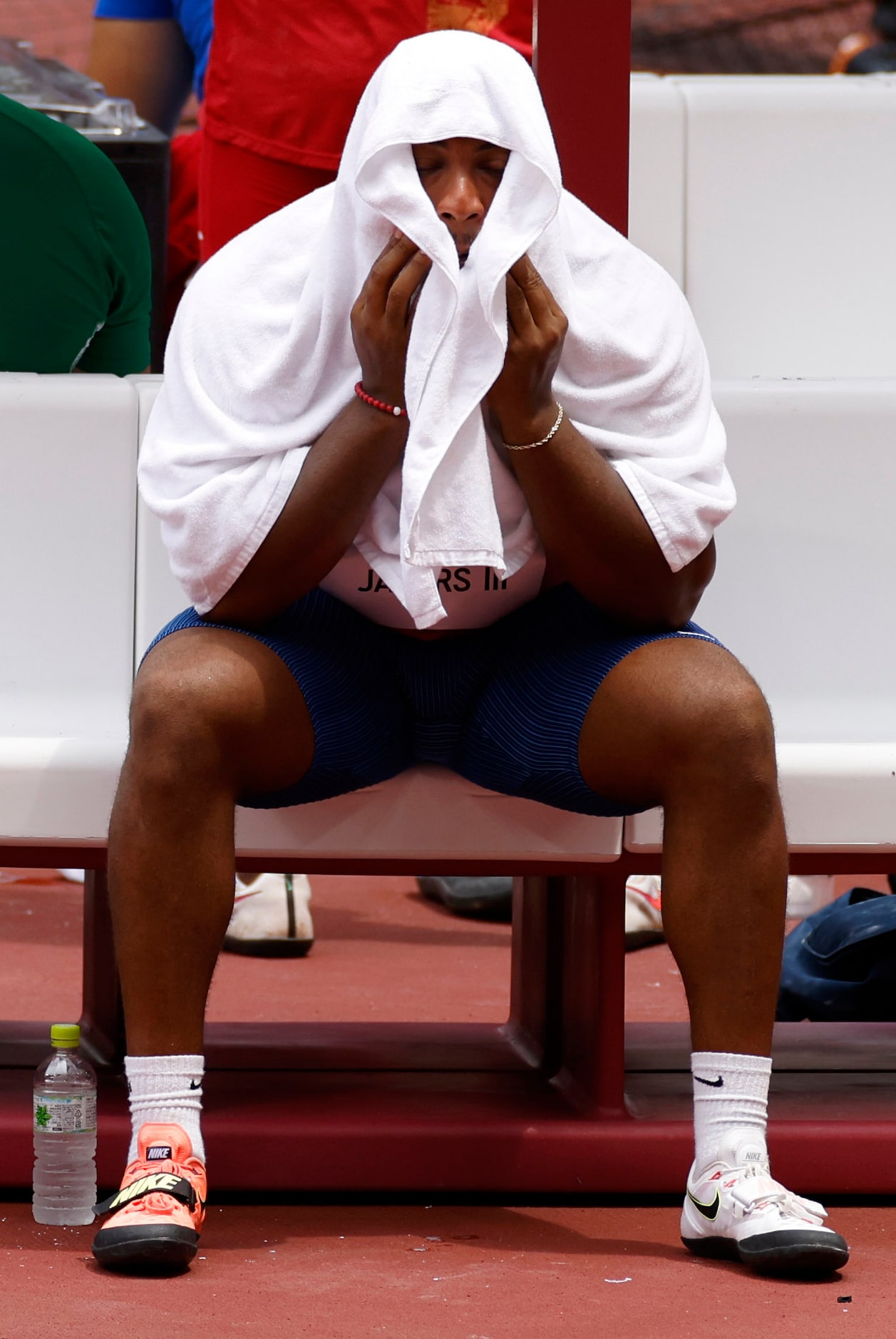 USA’s Reggie Jagers III sits dejected on the bench after not qualifying for the next round...