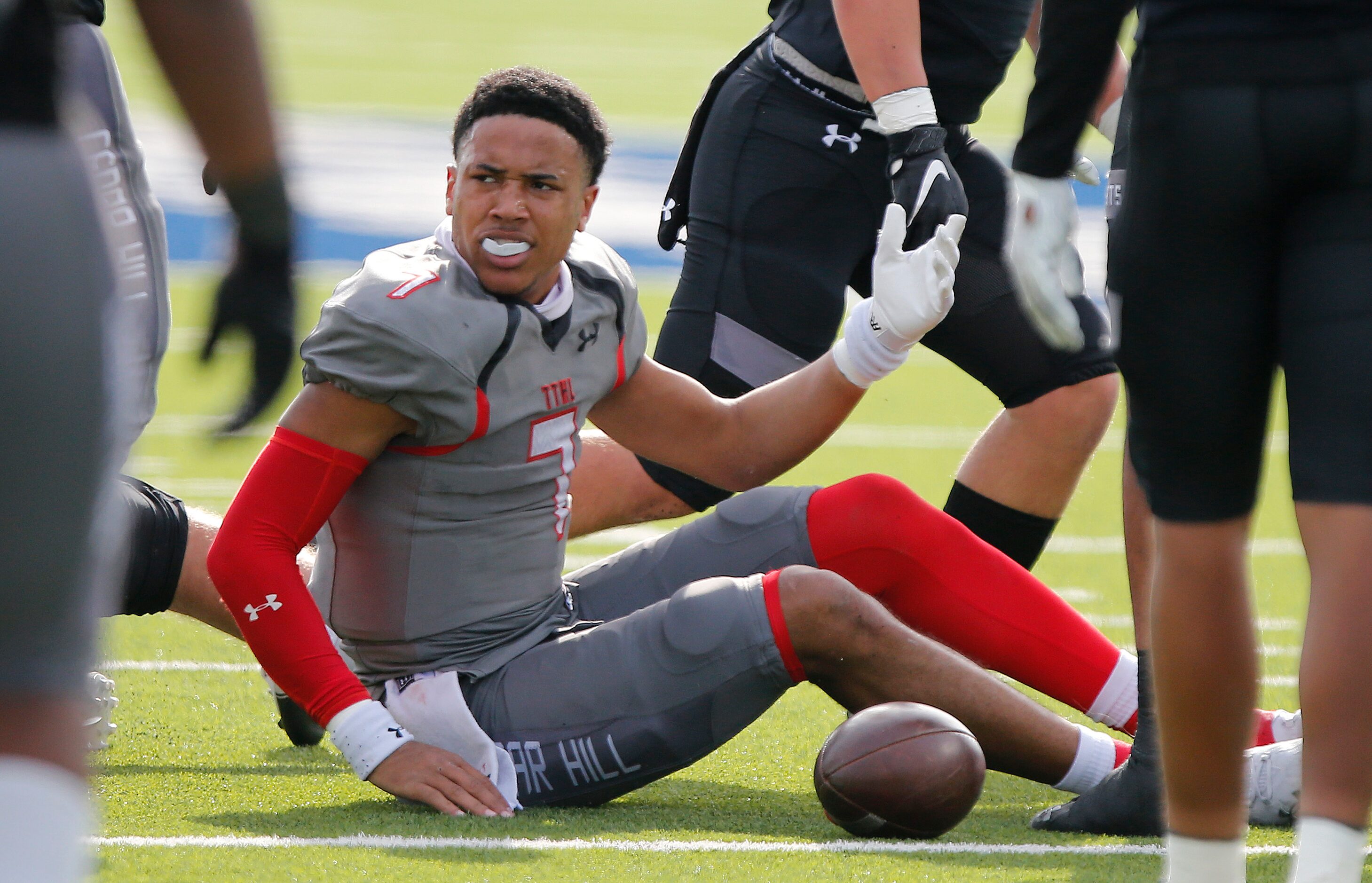 Cedar Hill High School quarterback Kaidon Salter (7) complains to the refs after his helmet...