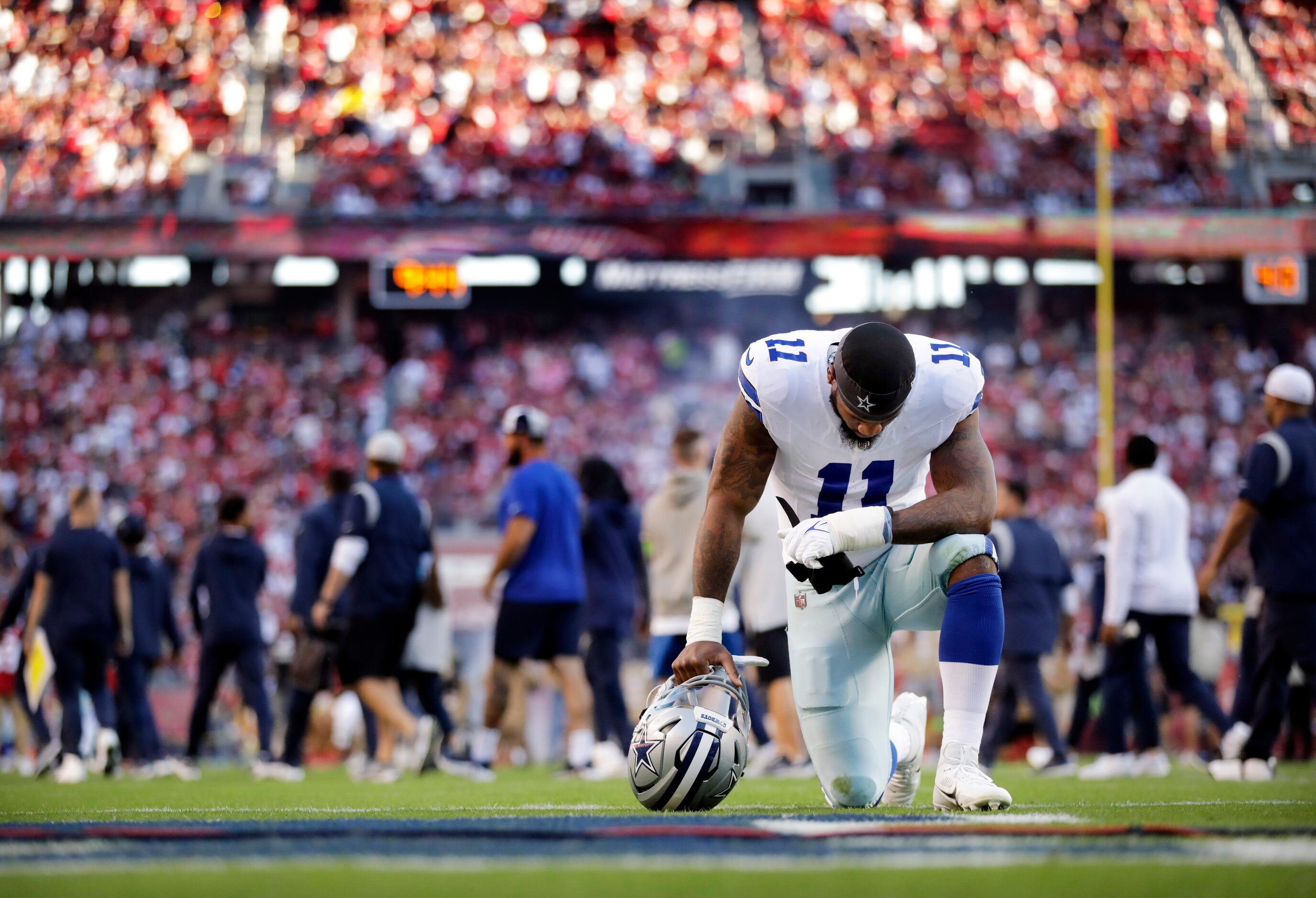 Dallas Cowboys linebacker Micah Parsons (11) takes a moment to himself near the goal line as...