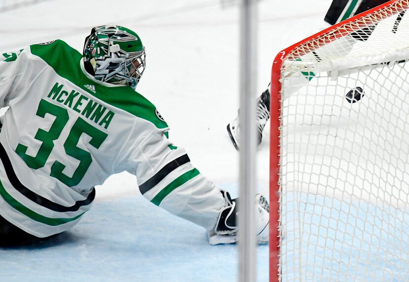 Dallas Stars goaltender Mike McKenna gives up a goal to Anaheim Ducks defenseman Josh Manson...