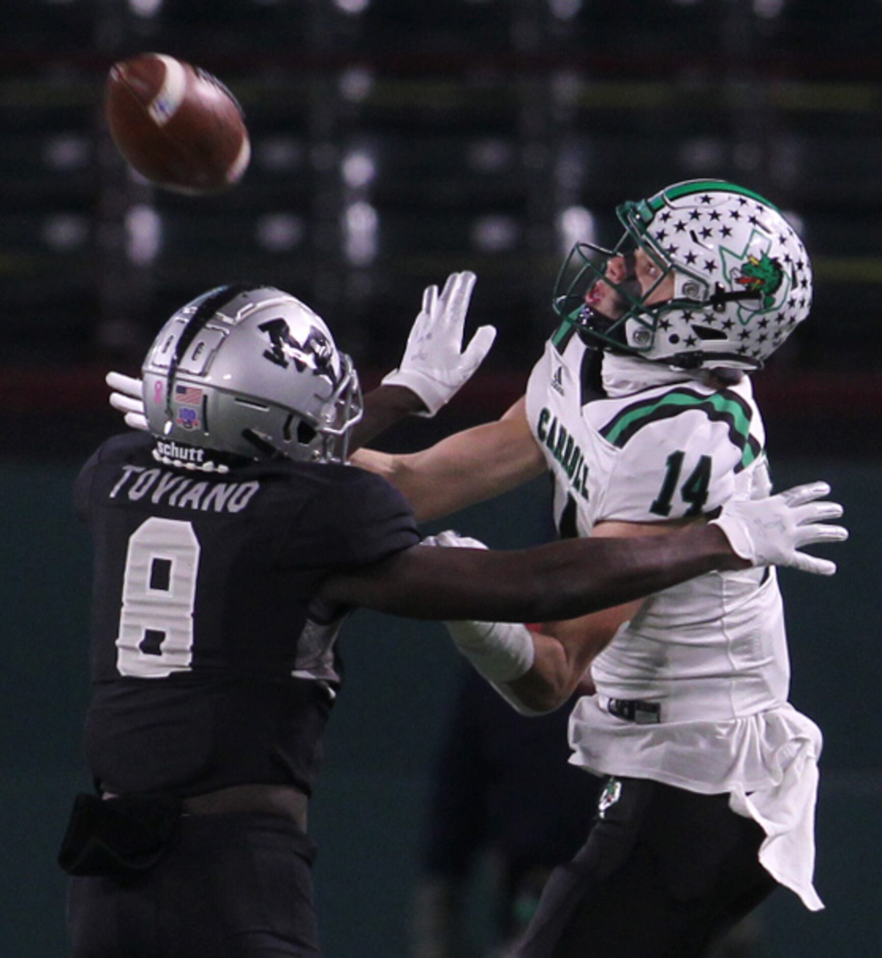 Southlake Carroll receiver Brady Boyd (14) eyes a long pass in as Arlington Martin defensive...