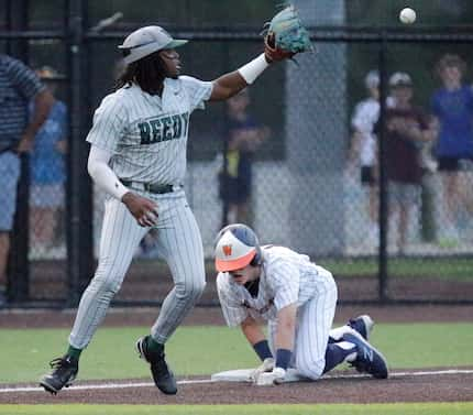 Reedy third baseman Ryan Alexander (4) fields a late throw as Wakeland shortstop Will...