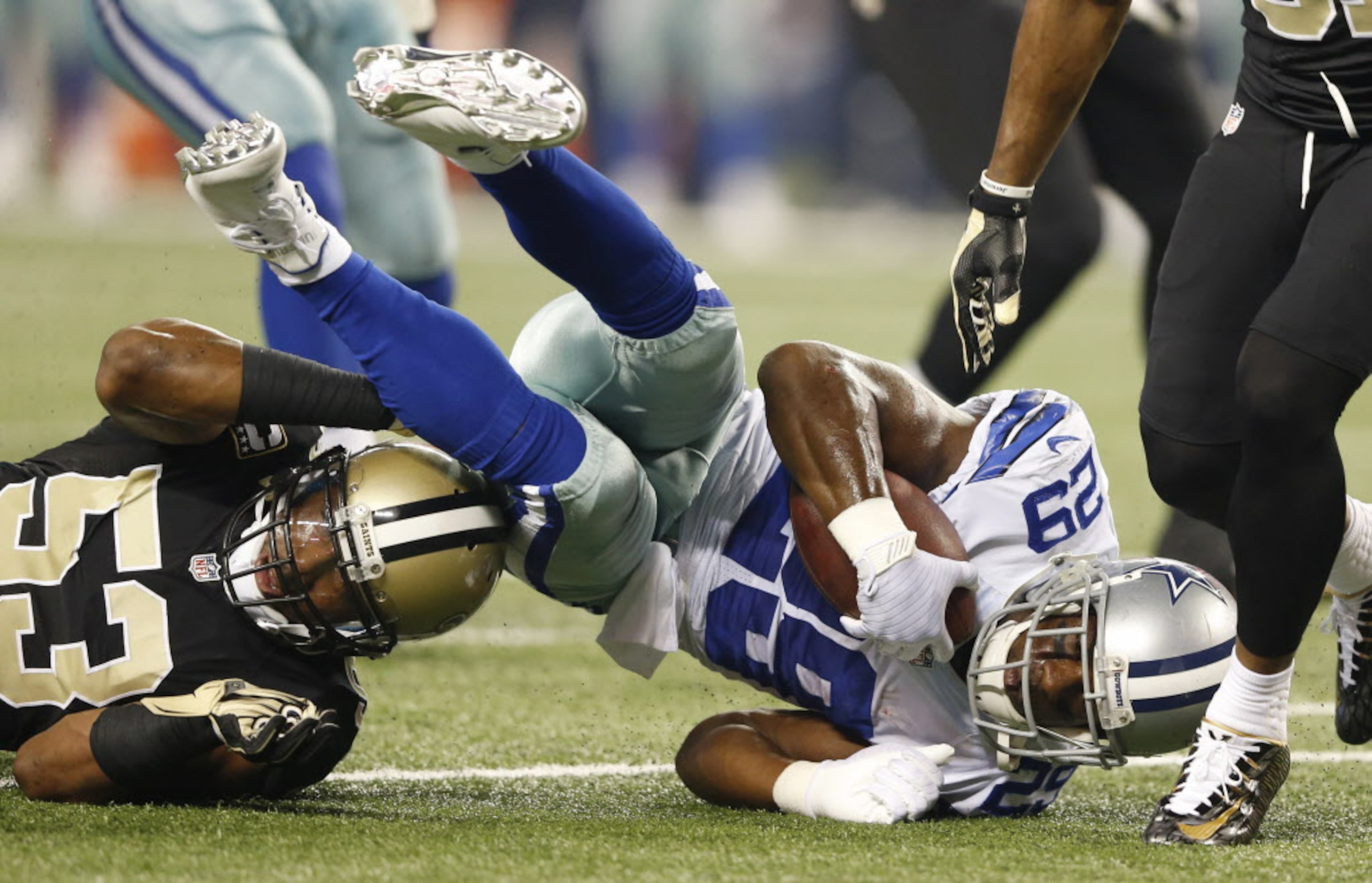 Dallas Cowboys running back DeMarco Murray (29) leans for extra yards after getting tackled...