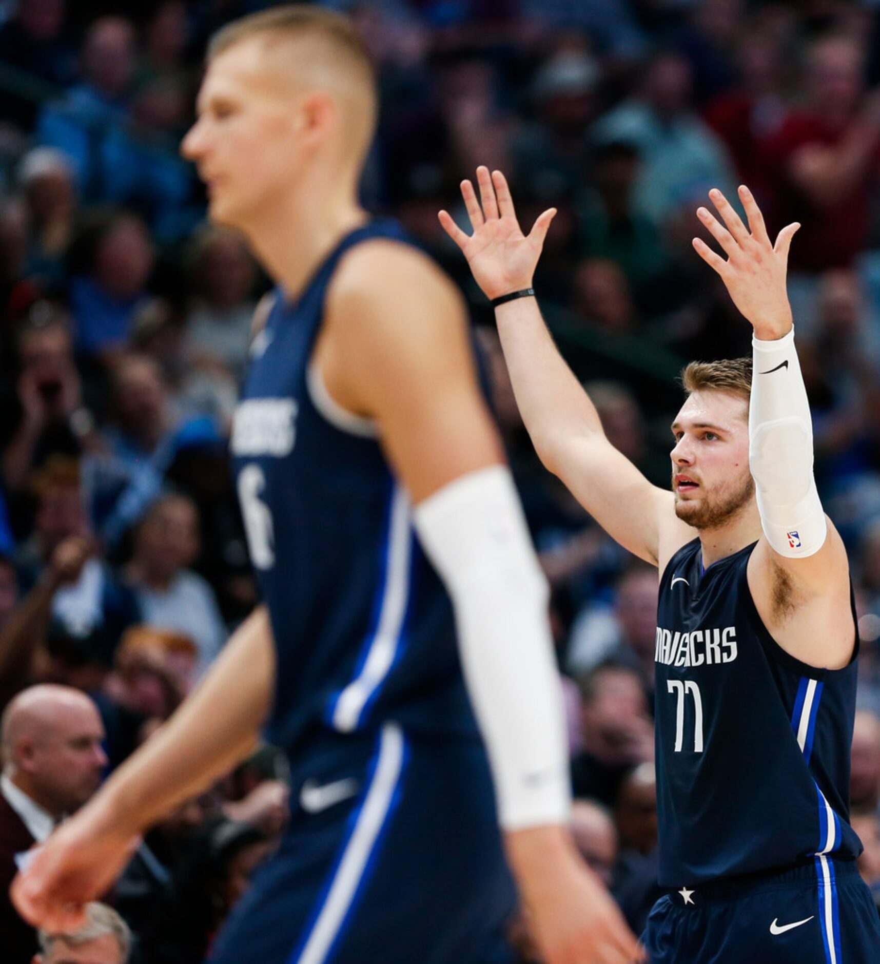 Dallas Mavericks guard Luka Doncic (77) celebrates a play during the third quarter of an NBA...