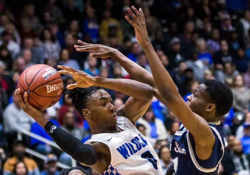 Wildcats player Sadaidriene Hall (0) tries to pass the ball as he is blocked by Rangers...