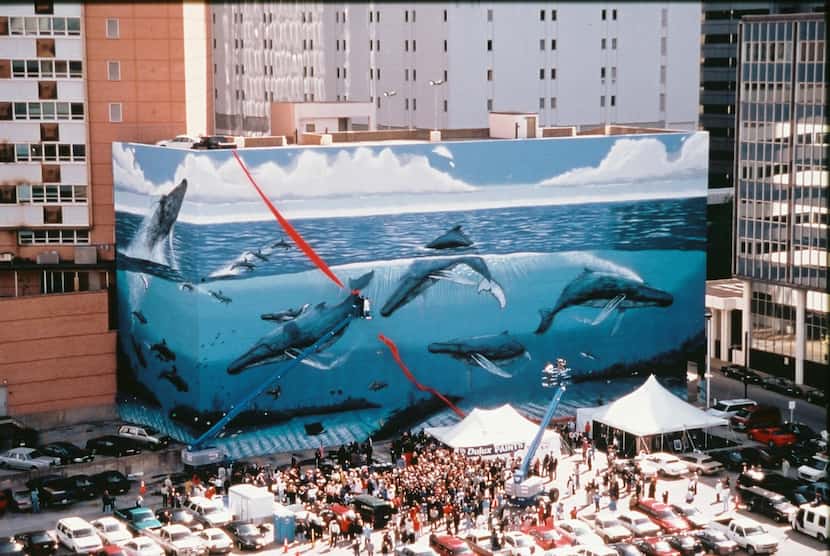 This photo was taken at the official dedication of Wyland's giant mural of humpback whales...