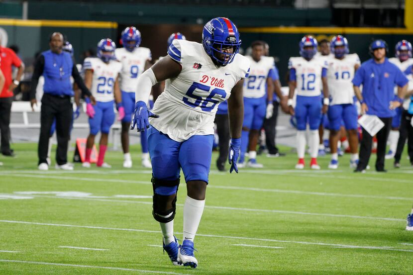 Duncanville offensive lineman Cameron Williams (56) looks to block against Cedar Hill during...