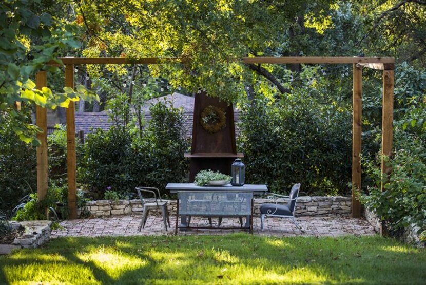 
In the Boyd-Lloyds’ lower garden, a simple arbor adds structure. The couple have already...