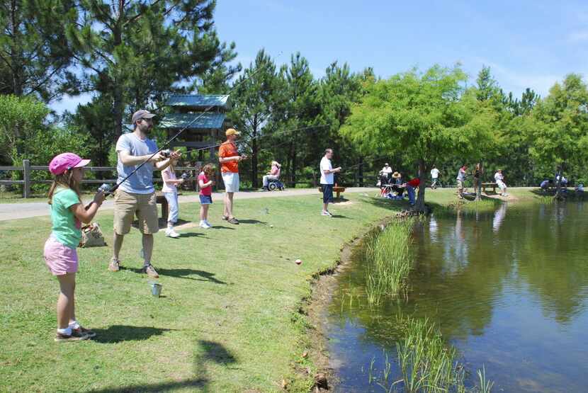 Children and adults alike can catch fish at the Texas Freshwater Fisheries Center near Athens. 