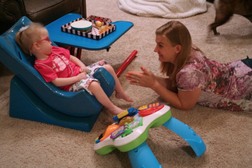 Penny Howard claps along to a song Harper started by pushing a button with her foot. Penny...