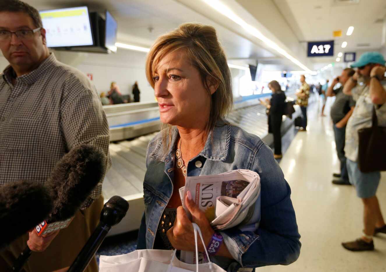 Teri Guerra of Fort Worth, talked with the media as she arrived at DFW International Airport...