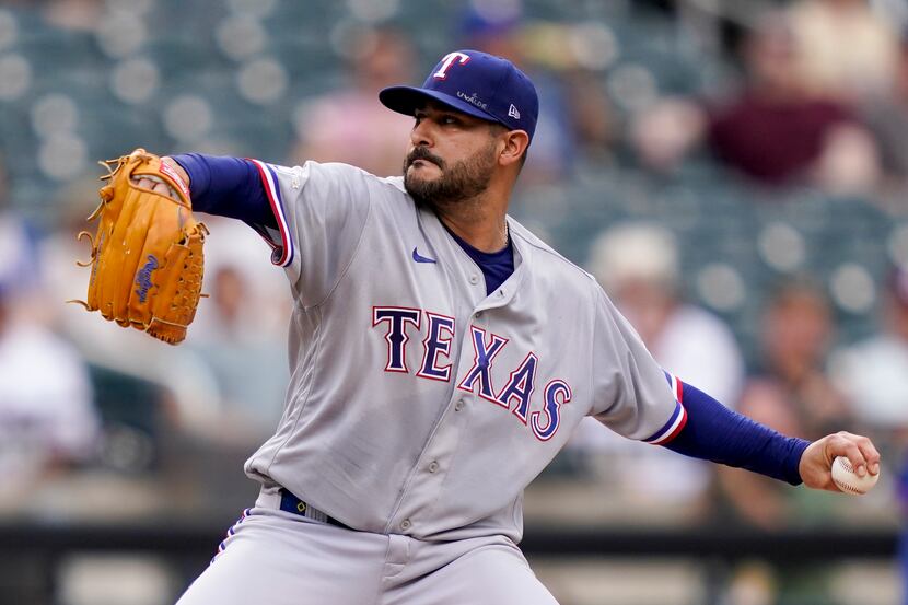 Texas Rangers starting pitcher Martin Perez (54) throws in the first inning of a baseball...