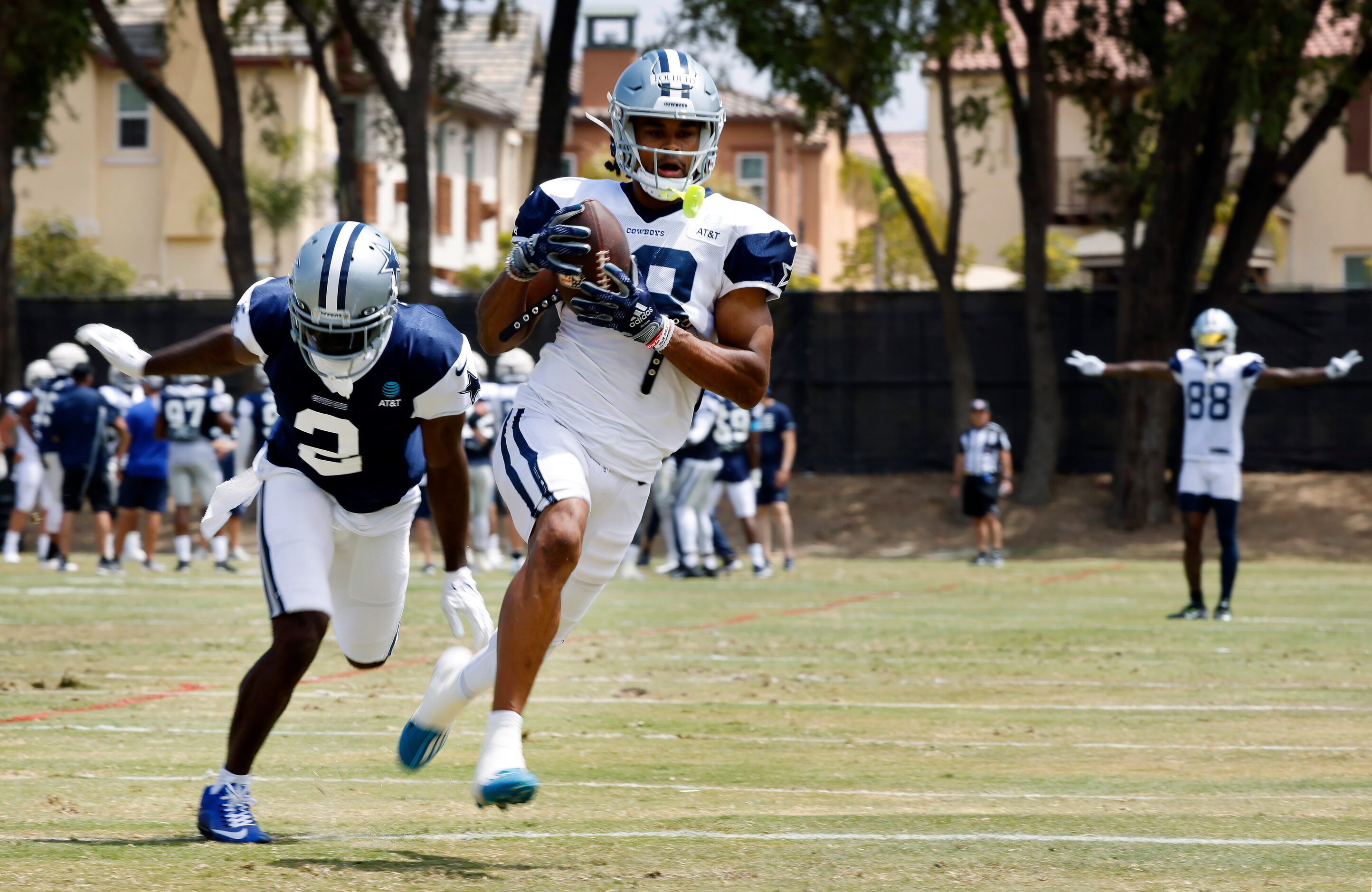 Dallas Cowboys wide receiver Jalen Tolbert (18) pulls in a deep pass as he’s covered by...