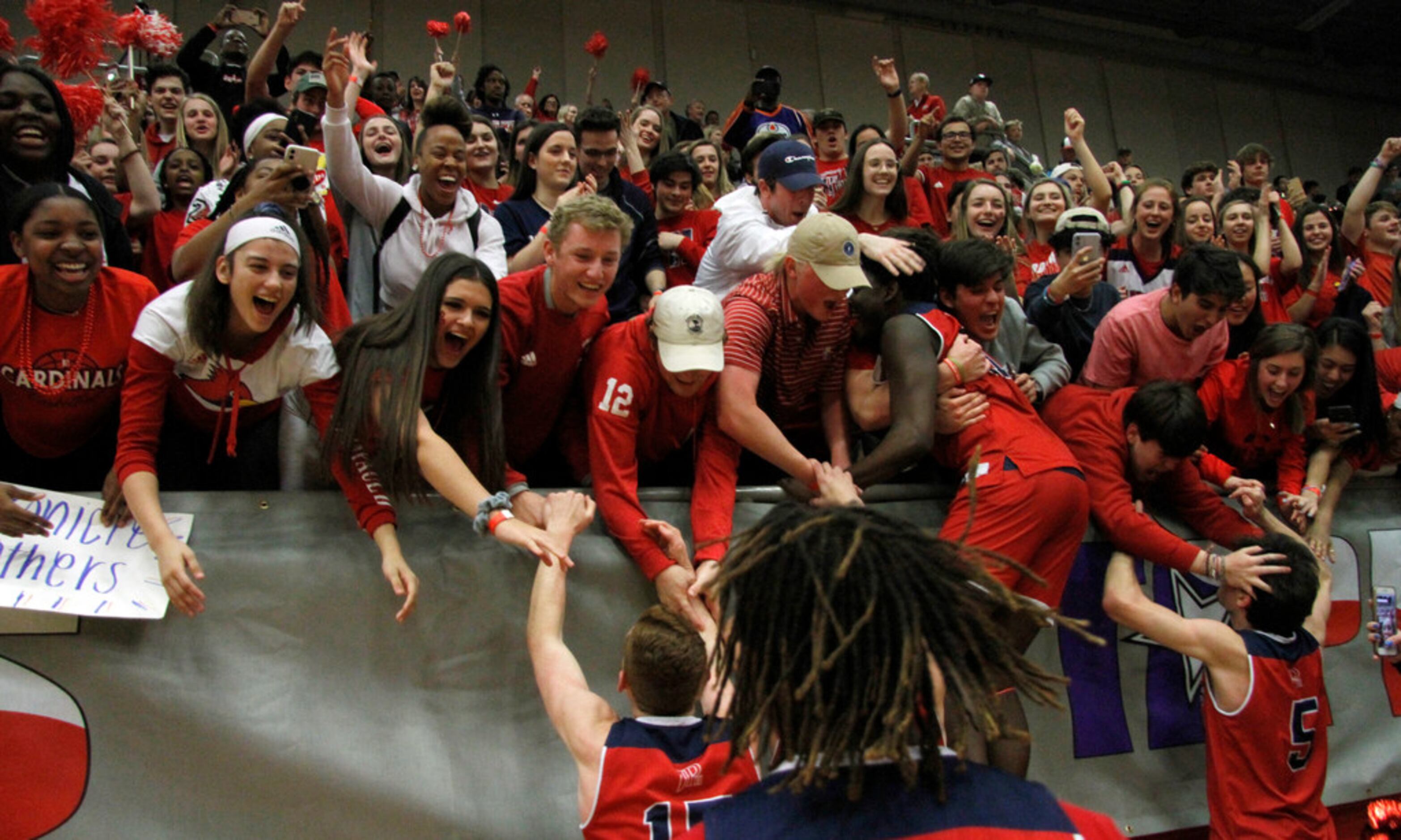 Plano John Paul ll fans broke into a state of euphoria as they hugged players after their...