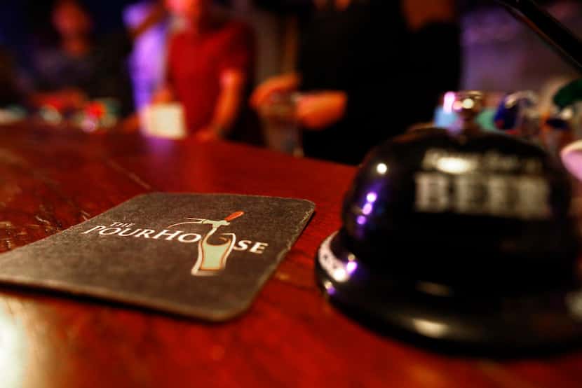 A custom-made coaster sits at the Pourhouse, a backyard bar in Nederland, Texas, on Sept. 5,...
