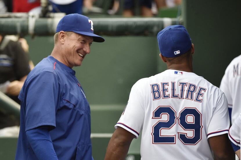 Texas Rangers manager Jeff Banister (28) greets Texas Rangers third baseman Adrian Beltre...