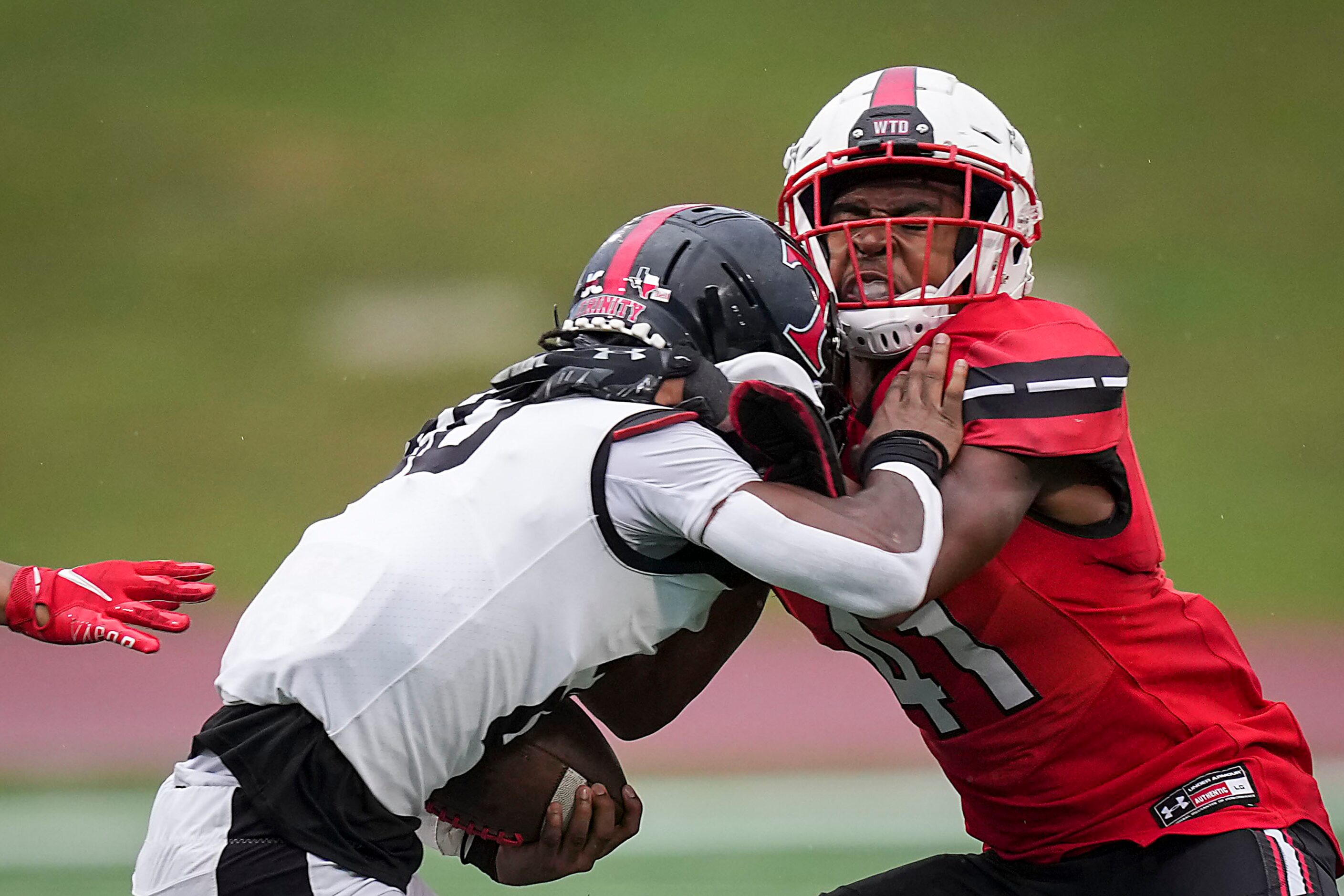 Rockwall-Heath linebacker Jayden Lexion (41) stops Euless Trinity running back Josh Bell...