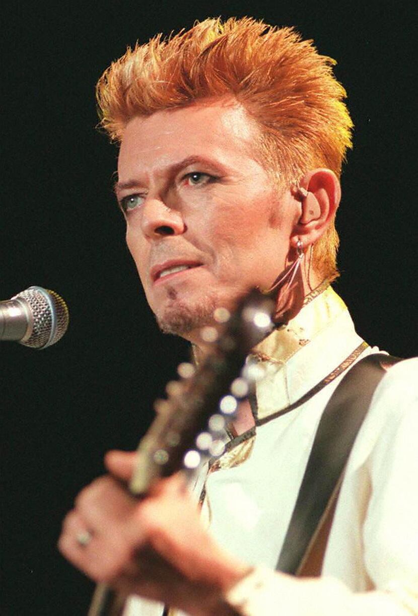 This file photo taken on July 14, 1997 shows British rock star David Bowie on stage at the...