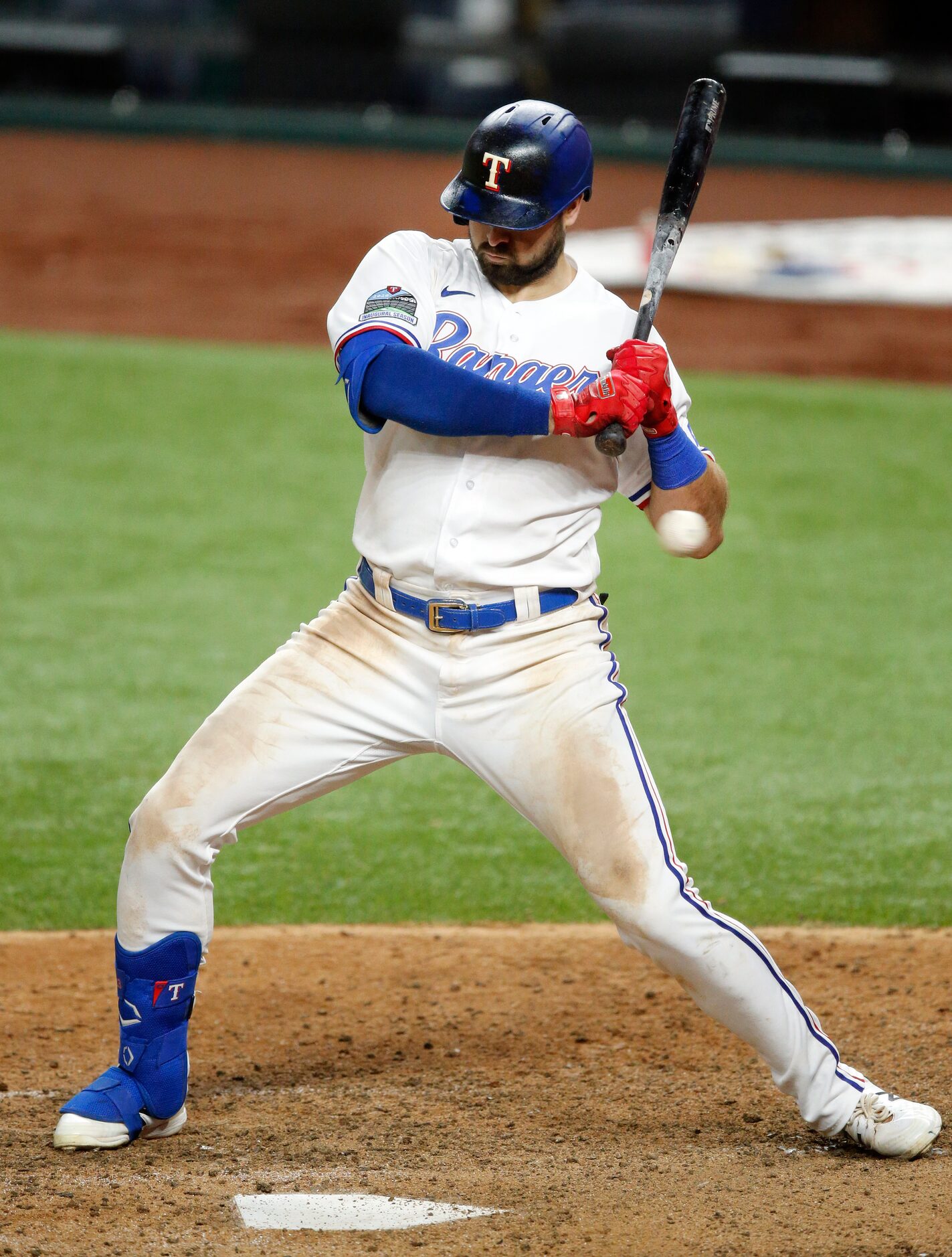 Texas Rangers batter Joey Gallo (13) leans  back from an inside pitch by Arizona...