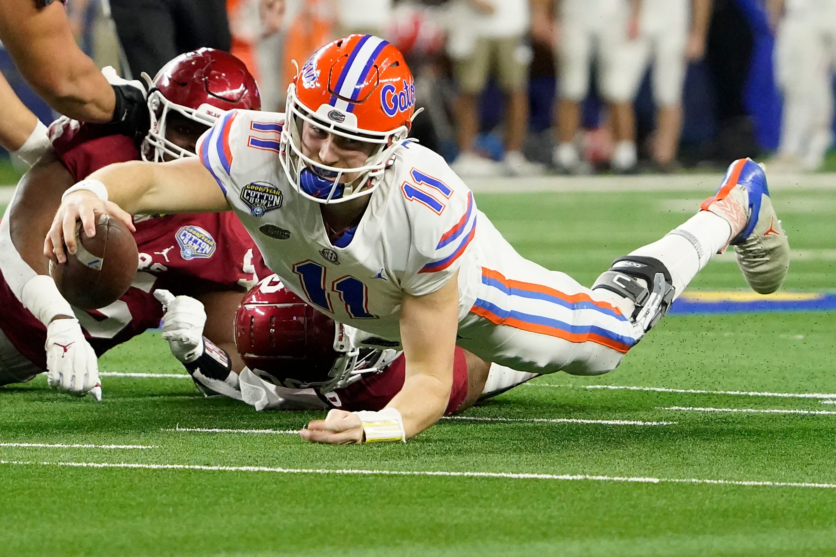 Florida quarterback Kyle Trask (11) dives for extra yardage during the first half of the...