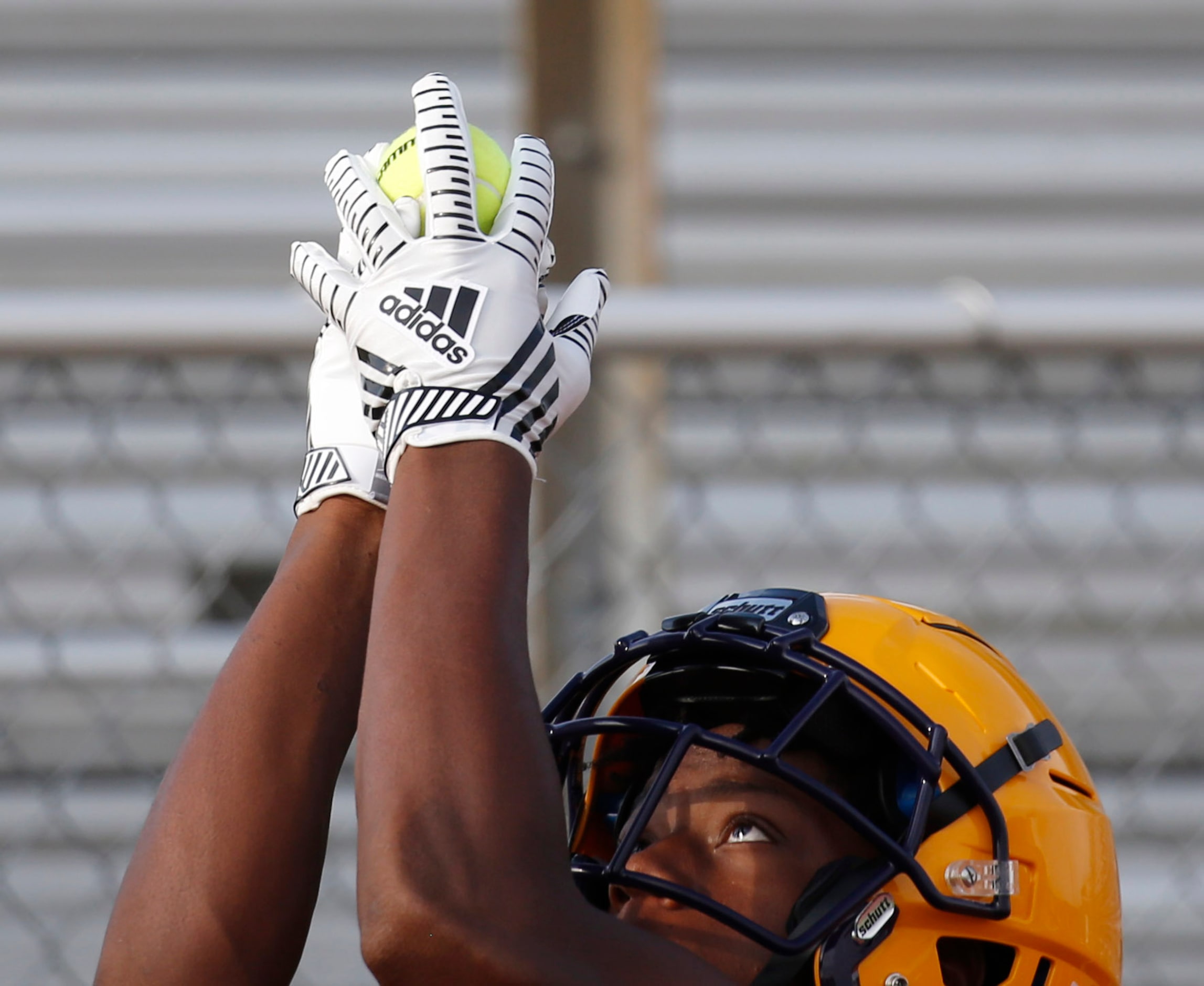 Farmersville's Noah Cottle catches a tennis ball during a drill during the first day of high...