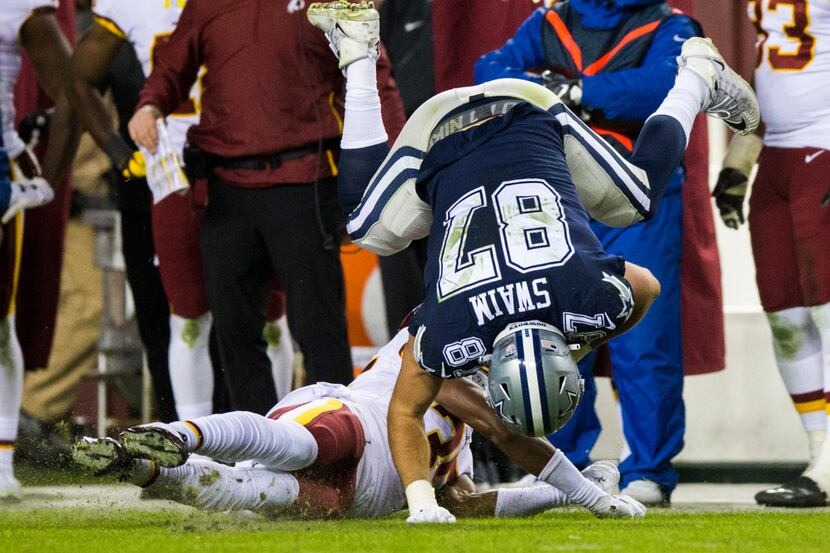 Dallas Cowboys tight end Geoff Swaim (87) is tackled by Washington Redskins strong safety...