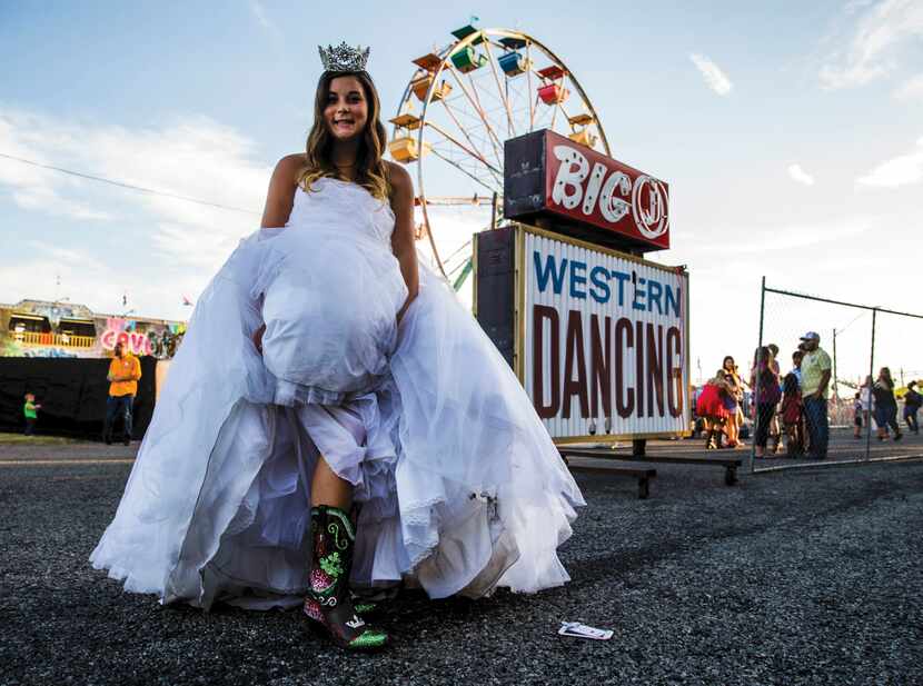 Lexi Carter, the Luling Watermelon Thump Queen 2016, shows off her custom-made cowboy boots...