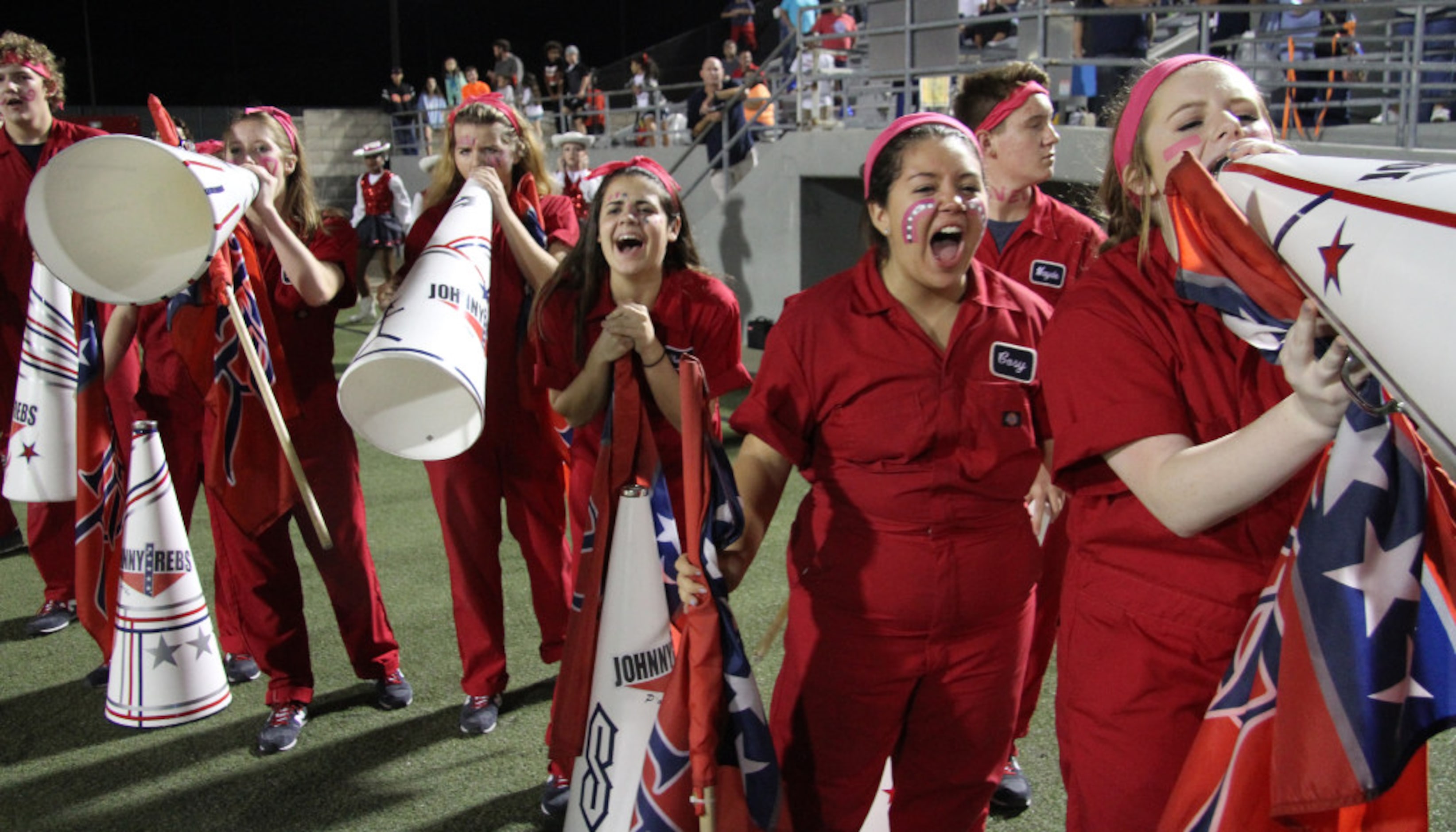 Members of the Richland rebels pep squad react to a crucial fourth down play late in the...