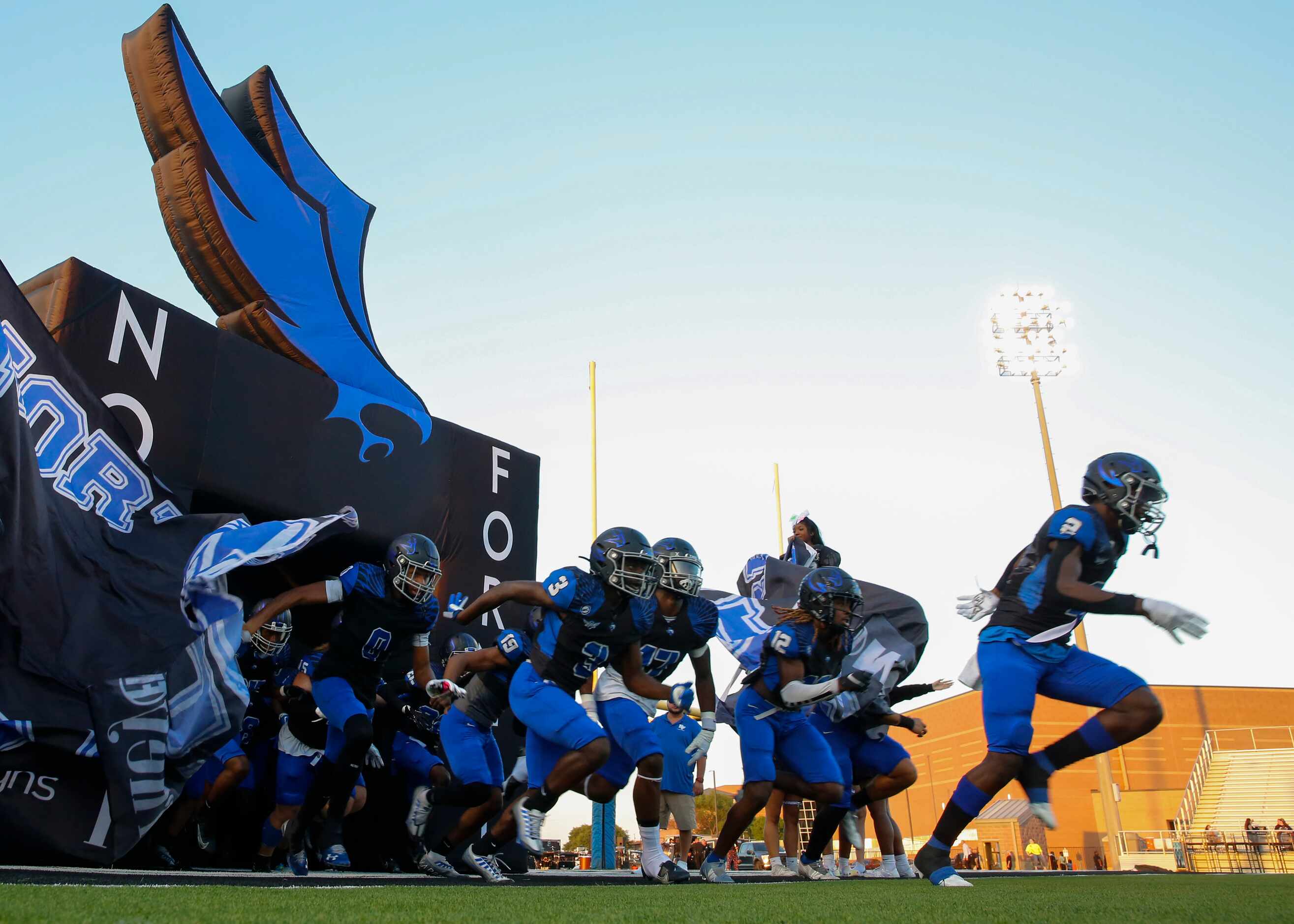 North Forney football players run out before the start of a District 10-6A homecoming...