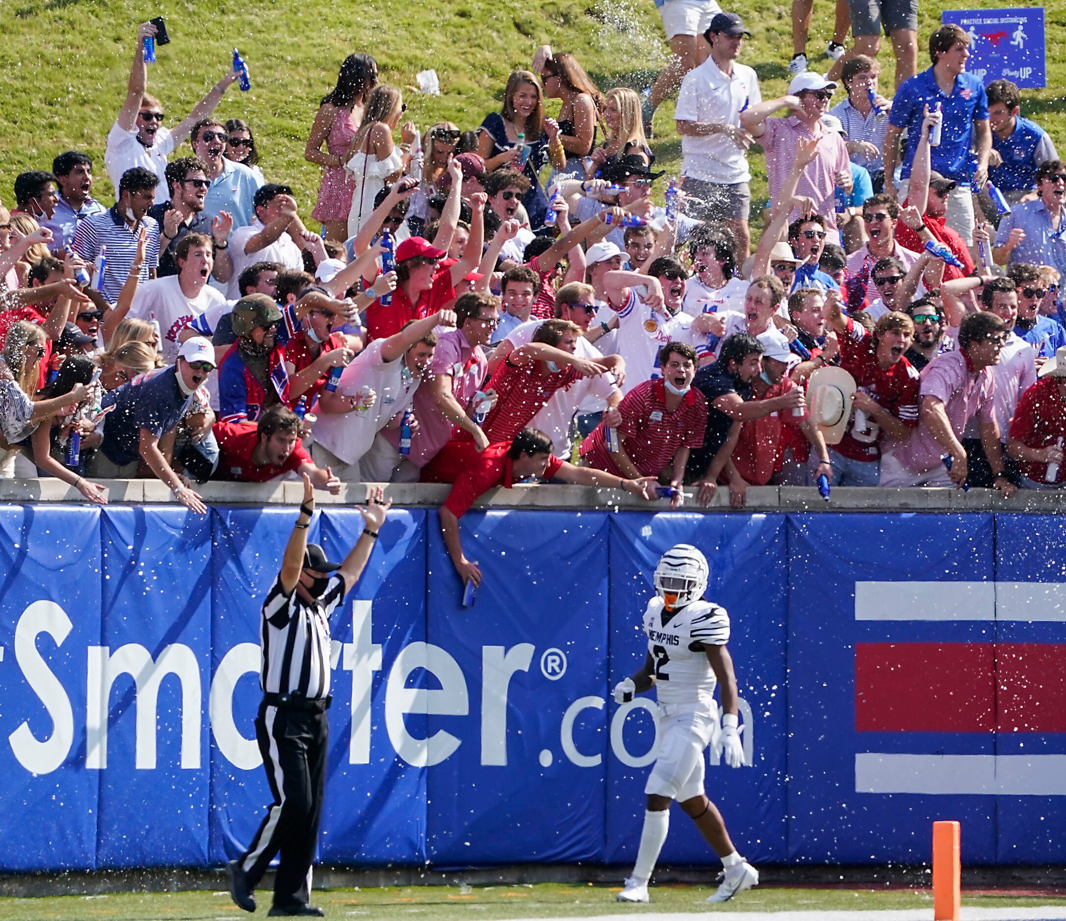 SMU fans in the student section on the hill cheer after a touchdown by wide receiver Reggie...