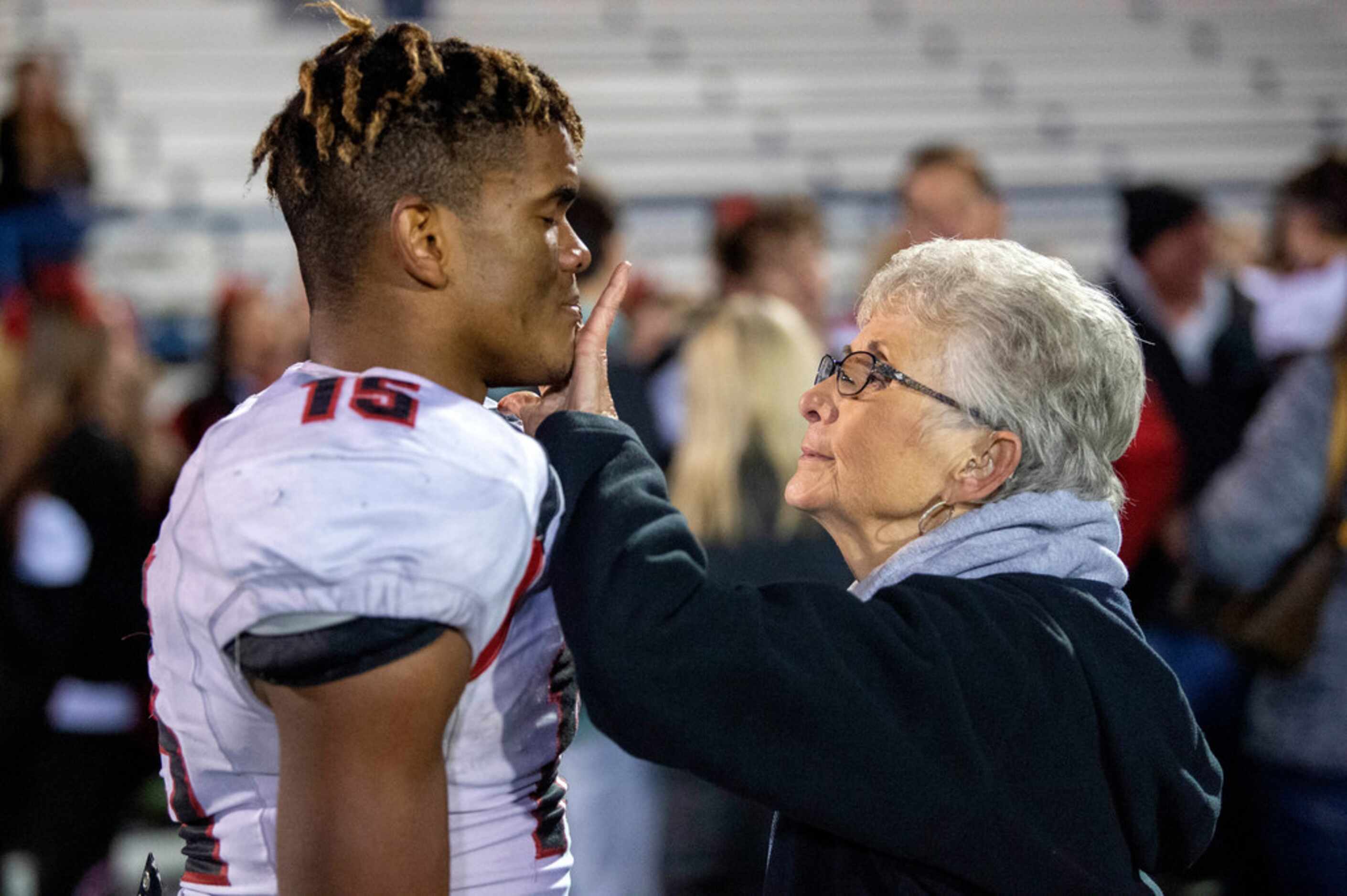 Lena Nelson, who worked at Fort Worth Christian for 30 years, wipes the tears of junior wide...