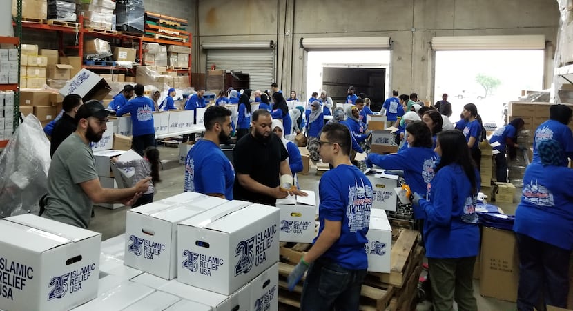 Islamic Relief USA volunteers in Richardson make food packets for people in need. (Islamic...