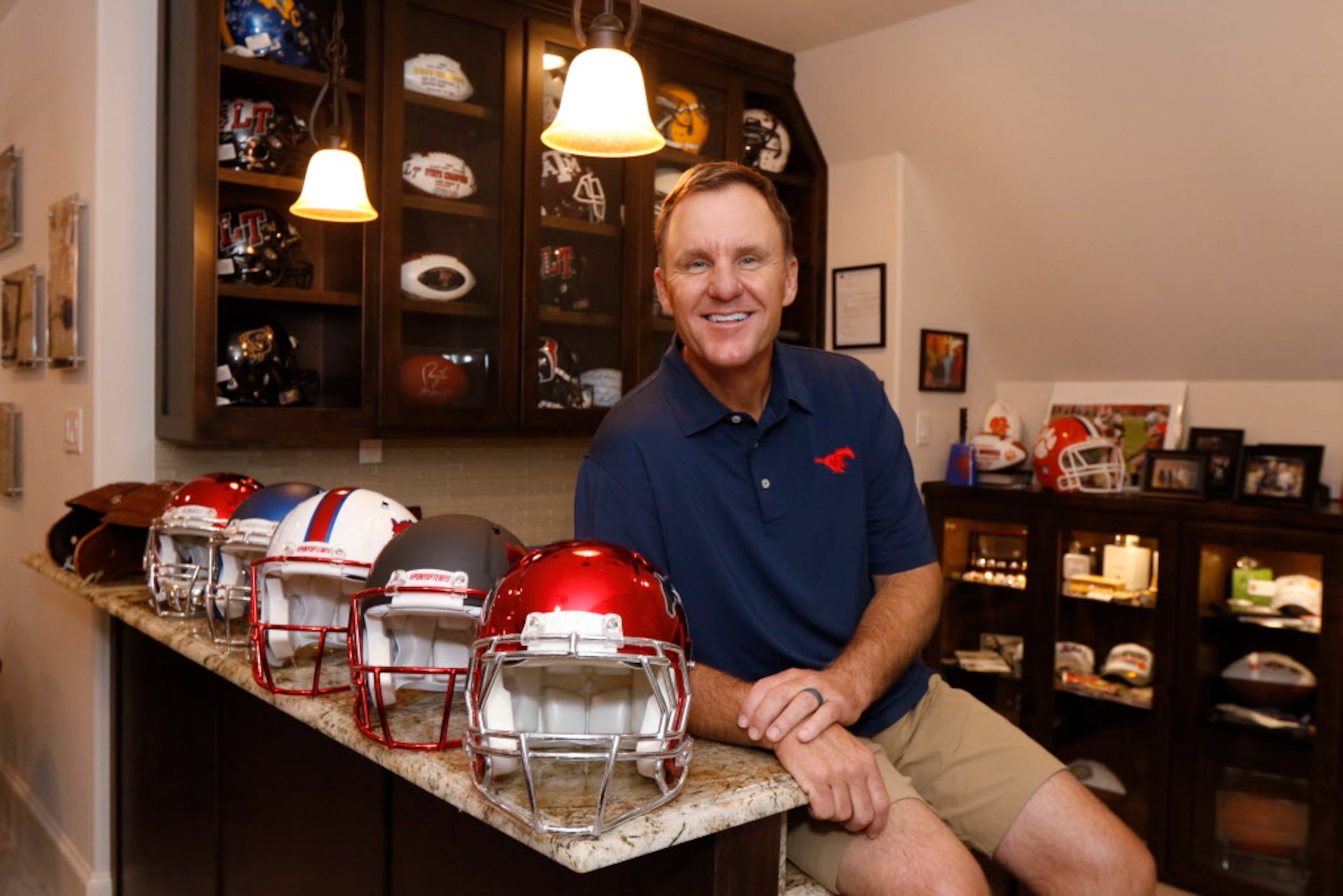 SMU head football coach Chad Morris poses for a portrait in his recruitment room in his home...