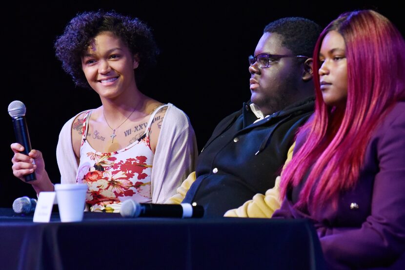 Justice Pearson (left), 18, smiles with tears in her eyes while speaking alongside Joshua...