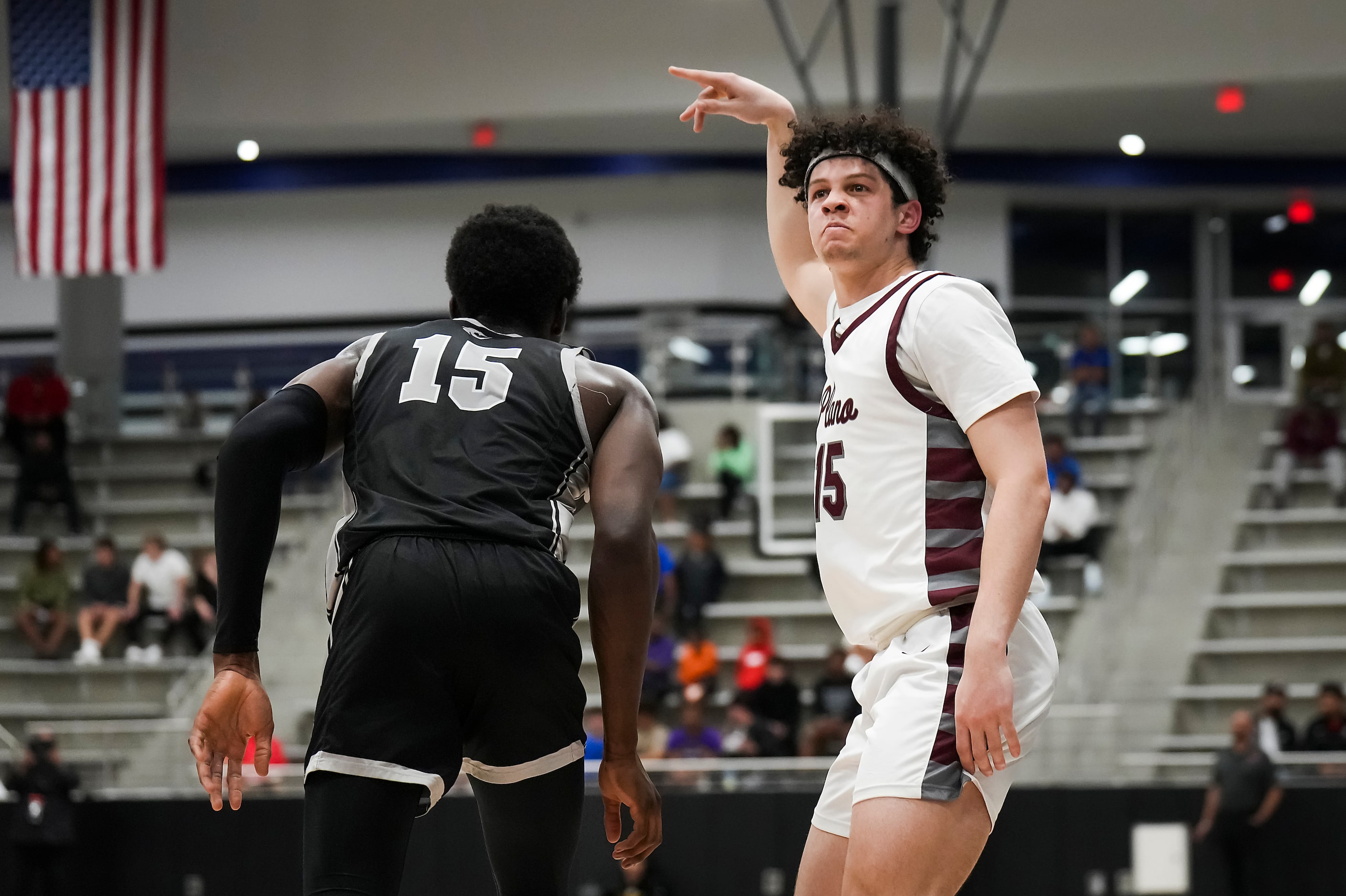 Plano guard Drew Forkner (right) celebrates after hitting a 3-pointer over Denton Guyer...